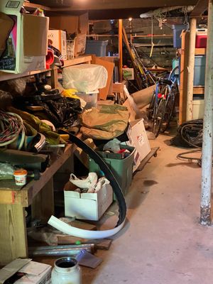 A cluttered garage filled with miscellaneous objects.